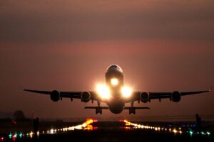 Airplane Landing On Runway With Runway Lights - Airport Lighting Company