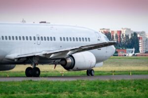 An Airplane Landing On The Runway - Airport Approach Lighting Systems - Airport Lighting Company