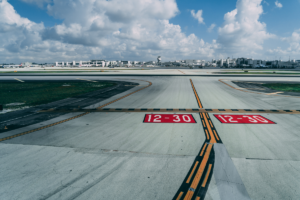 A guidance sign on an airport runway - Airport Lighting Company